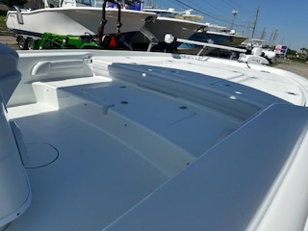 Slide: The Image of 2020 Yellowfin 24 Bay CE boat interior, showcasing spacious deck and seating area. - 22