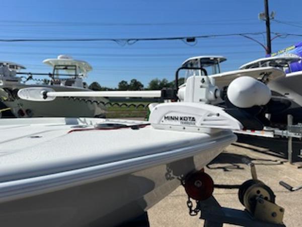Slide: The Image of 2020 Yellowfin 24 Bay CE boat with Minn Kota motor, displayed outdoors. - 23