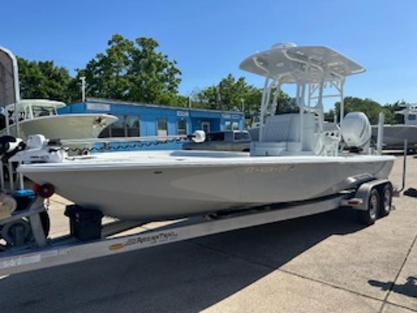 Slide: The Image of 2020 Yellowfin 24 Bay CE boat on trailer, parked outdoors under clear sky. - 3