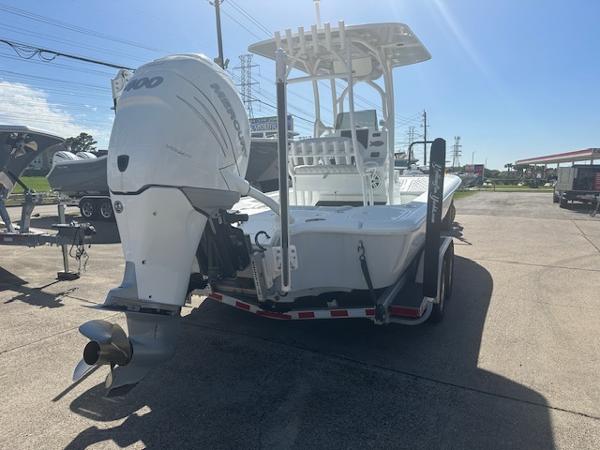Slide: The Image of 2020 Yellowfin 24 Bay CE boat with outboard motor on trailer, parked outdoors. - 5