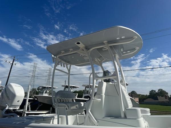 Slide: The Image of 2020 Yellowfin 24 Bay CE boat under a clear blue sky. - 7