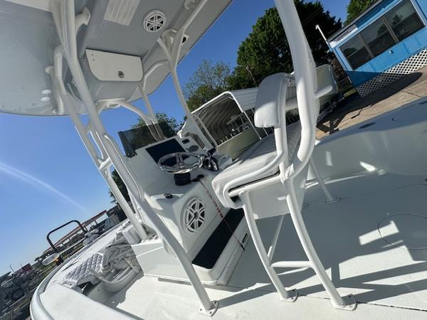 Slide: The Image of 2020 Yellowfin 24 Bay CE boat interior with seating and control panel. - 8