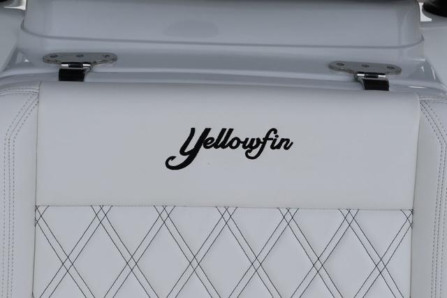 Slide: The Image of 2025 Yellowfin 26 Hybrid boat seat with logo and diamond stitching. - 23