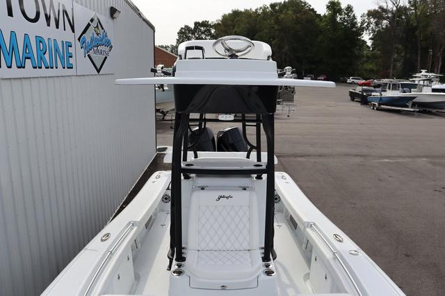 Slide: The Image of 2025 Yellowfin 26 Hybrid boat at a marina, showcasing sleek design and modern features. - 9