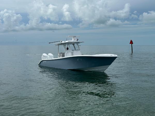 Slide: The Image of 2025 Yellowfin 32 boat on calm ocean waters under cloudy sky. - 10