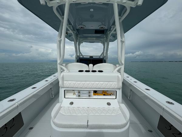Slide: The Image of 2025 Yellowfin 32 boat interior with white seating on a cloudy day. - 18