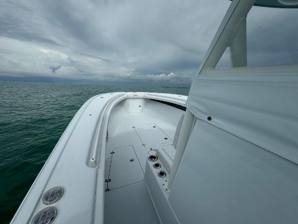 Slide: The Image of 2025 Yellowfin 32 boat on open water under cloudy skies. - 20