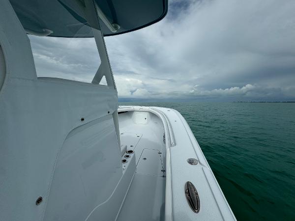 Slide: The Image of 2025 Yellowfin 32 boat on calm sea under cloudy sky. - 21