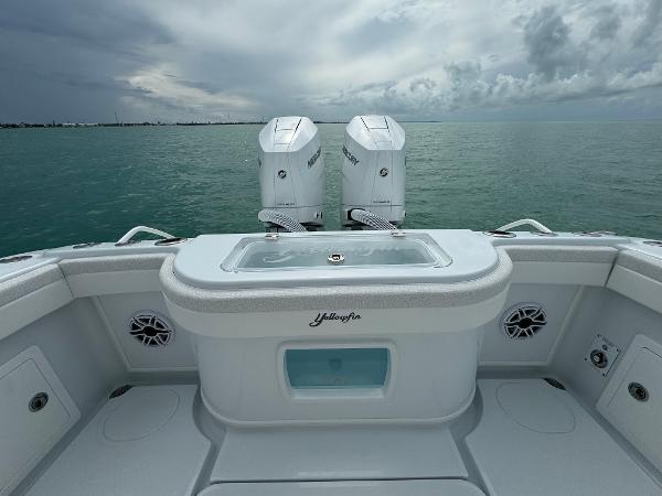 Slide: The Image of 2025 Yellowfin 32 boat with twin outboard motors on calm sea. - 24