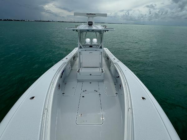 Slide: The Image of 2025 Yellowfin 32 boat on calm sea under cloudy sky. - 28