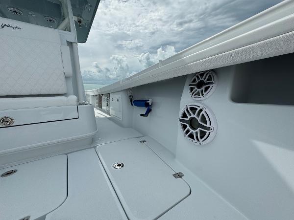 Slide: The Image of 2025 Yellowfin 32 boat interior with speakers and storage compartments. - 29