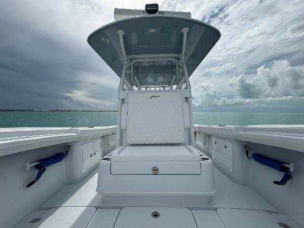 Slide: The Image of 2025 Yellowfin 32 boat on open water under cloudy sky. - 30
