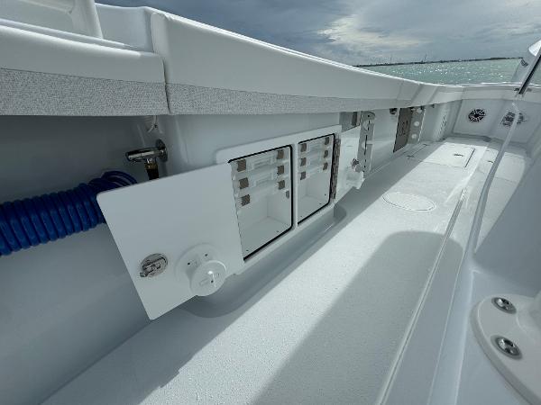 Slide: The Image of 2025 Yellowfin 32 boat interior with storage compartments and sleek design. - 34