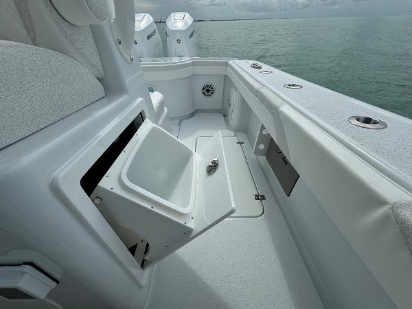 Slide: The Image of 2025 Yellowfin 32 boat interior with open storage compartment, ocean view. - 36