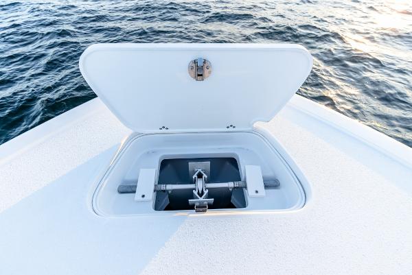 Slide: The Image of Open anchor compartment on 2023 Yellowfin 34 boat, with ocean background. - 29