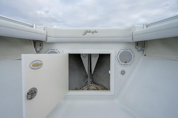 Slide: The Image of 2009 Yellowfin 36 boat anchor storage compartment with open hatch. - 10