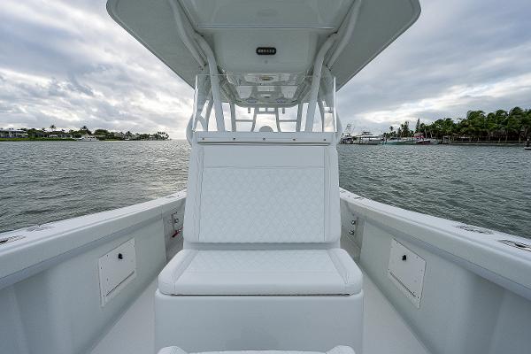 Slide: The Image of 2009 Yellowfin 36 boat with white seating on calm waters. - 13
