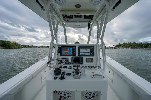Slide: The Image of 2009 Yellowfin 36 boat console with navigation equipment on the water. - 15
