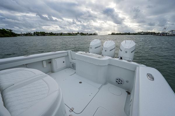 Slide: The Image of 2009 Yellowfin 36 boat with triple Mercury outboard engines on calm water. - 17