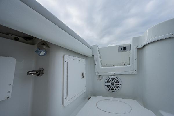 Slide: The Image of 2009 Yellowfin 36 boat interior with storage compartments and speaker. - 19