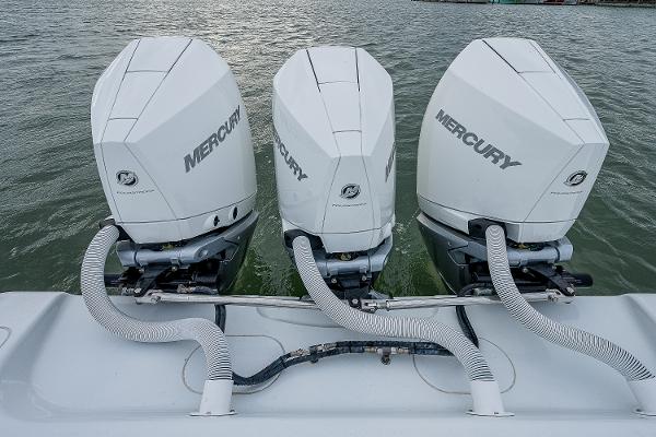 Slide: The Image of 2009 Yellowfin 36 boat with triple Mercury outboard engines. - 23