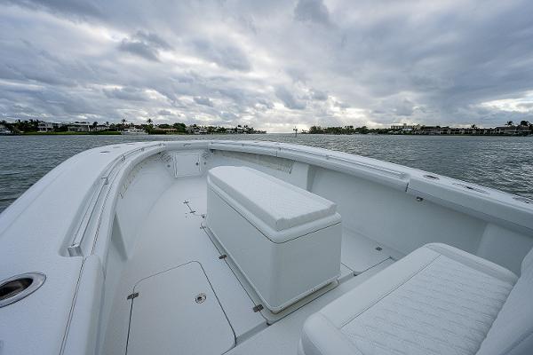 Slide: The Image of 2009 Yellowfin 36 boat with spacious deck and seating, on a cloudy day. - 5