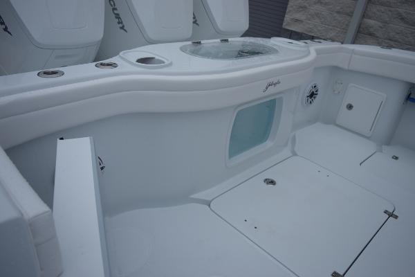 Slide: The Image of 2024 Yellowfin 42 boat deck with storage compartments and seating. - 13