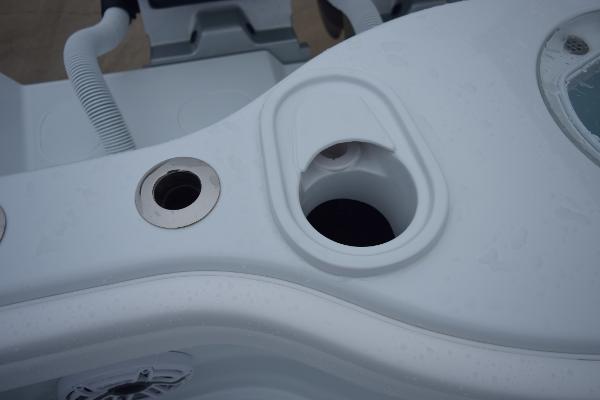 Slide: The Image of 2024 Yellowfin 42 boat console with cup holders and hose attachments. - 15