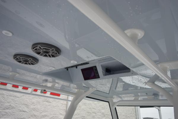 Slide: The Image of 2024 Yellowfin 42 boat interior ceiling with speakers and electronic console. - 17