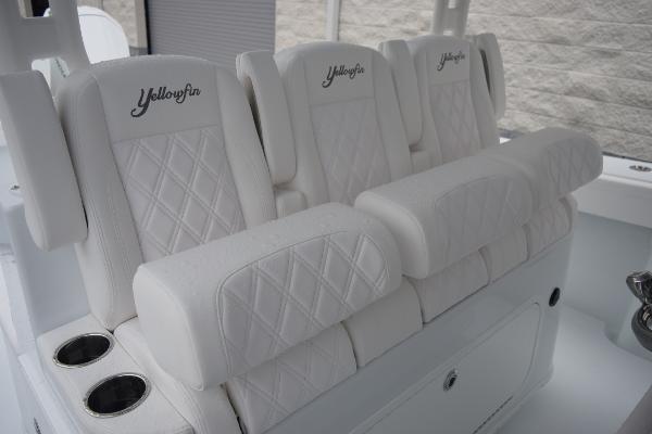 Slide: The Image of Luxurious white seating on 2024 Yellowfin 42 boat with cup holders. - 19