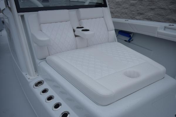 Slide: The Image of 2024 Yellowfin 42 boat with luxurious white seating and cup holders. - 21