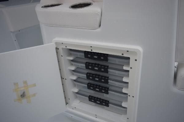 Slide: The Image of 2024 Yellowfin 42 boat storage compartment with multiple tackle trays. - 36