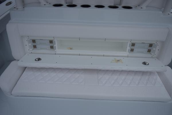 Slide: The Image of 2024 Yellowfin 42 boat storage compartment with cushioned seating. - 37