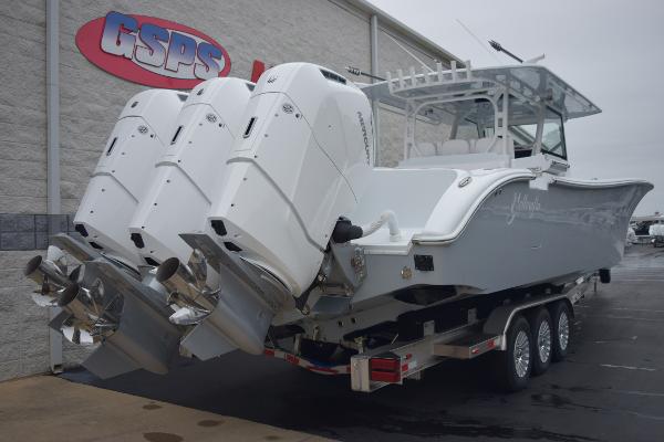 Slide: The Image of 2024 Yellowfin 42 boat with triple outboard engines on a trailer at GSPS dealership. - 4
