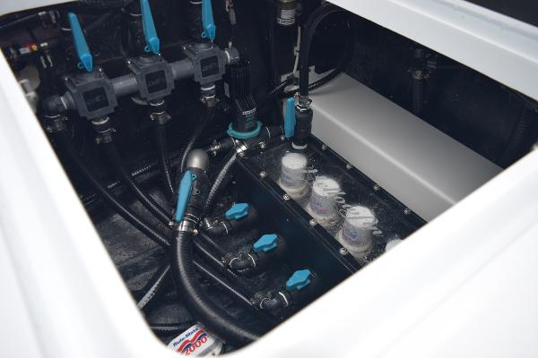 Slide: The Image of Engine compartment of a 2024 Yellowfin 42 boat with various mechanical components. - 41
