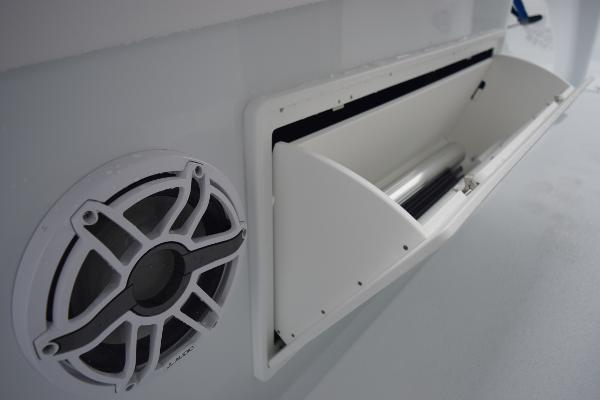 Slide: The Image of Close-up of a 2024 Yellowfin 42 boat's speaker and storage compartment. - 43