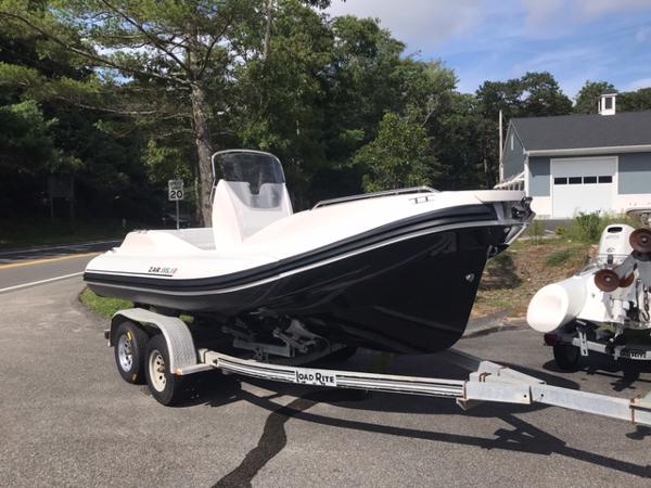 Slide: The Image of 2024 Zar Formenti 59 SL boat on trailer in outdoor setting. - 0