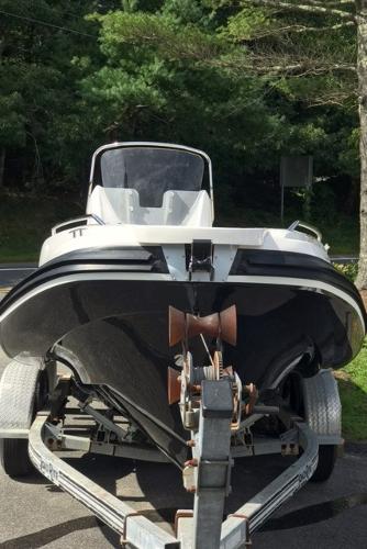 Slide: The Image of 2024 Zar Formenti 59 SL boat on a trailer, front view, parked outdoors. - 4