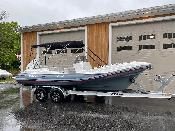 Slide: The Image of 2023 Zar Formenti Zar 65 boat on trailer in front of garage. - 3
