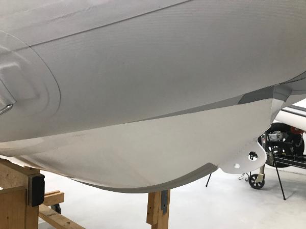 Slide: The Image of 2023 Zodiac Cadet 300 RIB ALU PVC boat hull on wooden stand. - 5