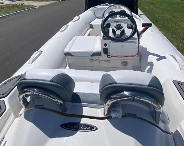 Slide: The Image of 2024 Zodiac Yachtline 360 inflatable boat interior with steering console and seating. - 2