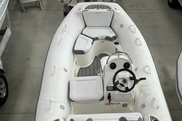 Slide: The Image of 2023 Zodiac Yachtline 490 Deluxe NEO 90hp inflatable boat, white interior, steering console. - 1