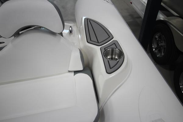 Slide: The Image of 2023 Zodiac Yachtline 490 Deluxe NEO 90hp, white seating area with cup holder. - 10