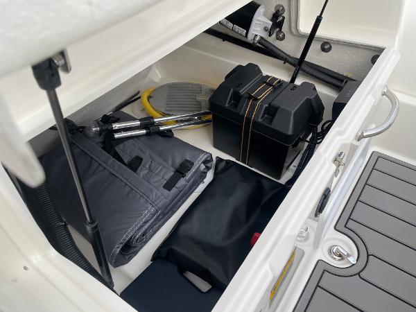 Slide: The Image of Storage compartment of 2023 Zodiac Yachtline 490 Deluxe NEO 90hp with boating accessories. - 15
