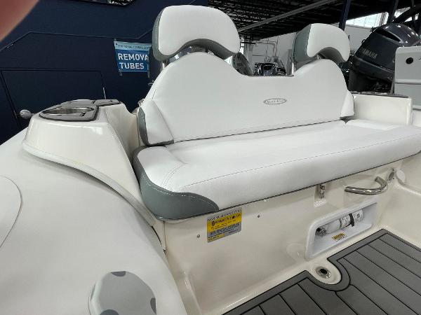 Slide: The Image of 2023 Zodiac Yachtline 490 Deluxe NEO 90hp boat seating area with white upholstery. - 20