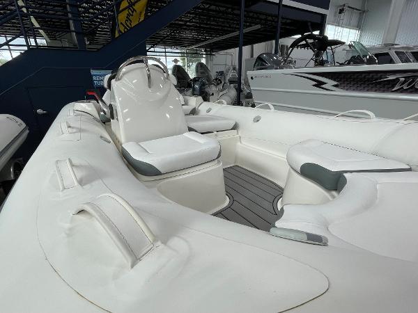 Slide: The Image of 2023 Zodiac Yachtline 490 Deluxe NEO 90hp inflatable boat interior in showroom. - 22
