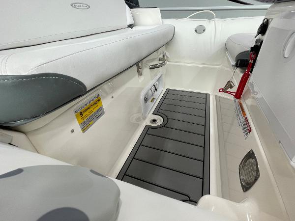Slide: The Image of Interior of 2023 Zodiac Yachtline 490 Deluxe NEO 90hp boat, featuring seating and storage area. - 25